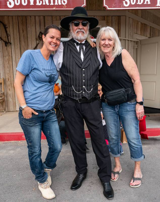 John Clausen/Pahrump Valley Times Alina Quinata, left, and Randi Case, right, pose with a membe ...