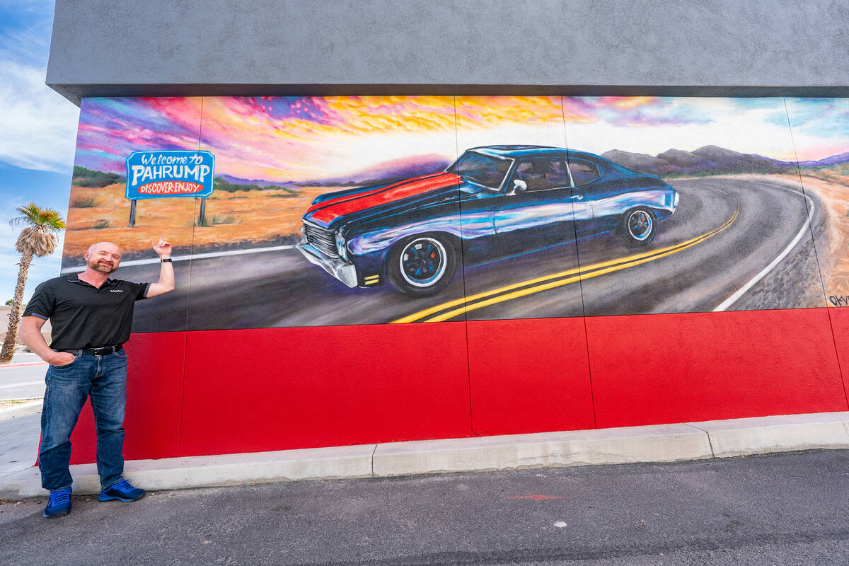 John Clausen/Pahrump Valley Times State Farm Insurance agent Brian Strain stands before a mural ...