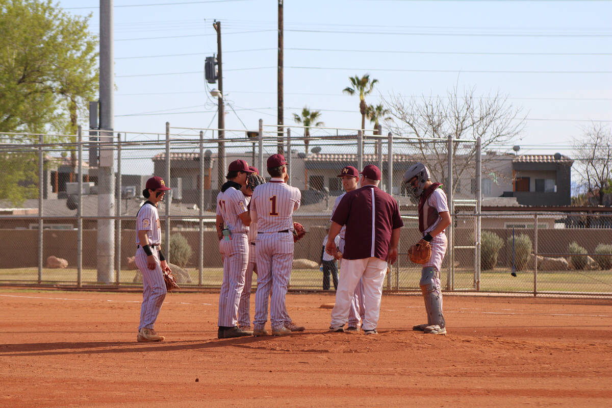 Jacob Powers/Pahrump Valley Times The Trojans infield gathers following a mound visit during th ...