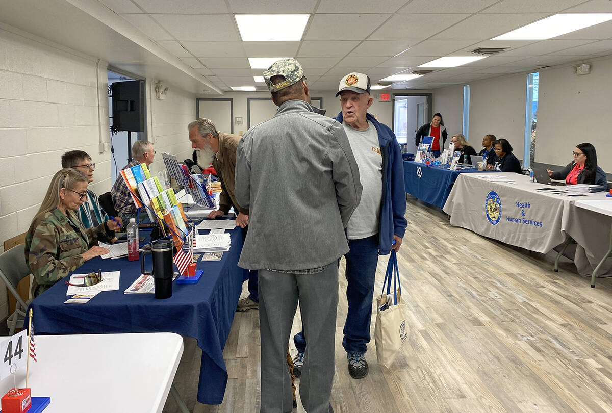 Robin Hebrock/Pahrump Valley Times A couple of Veterans Extravaganza attendees pause in their b ...