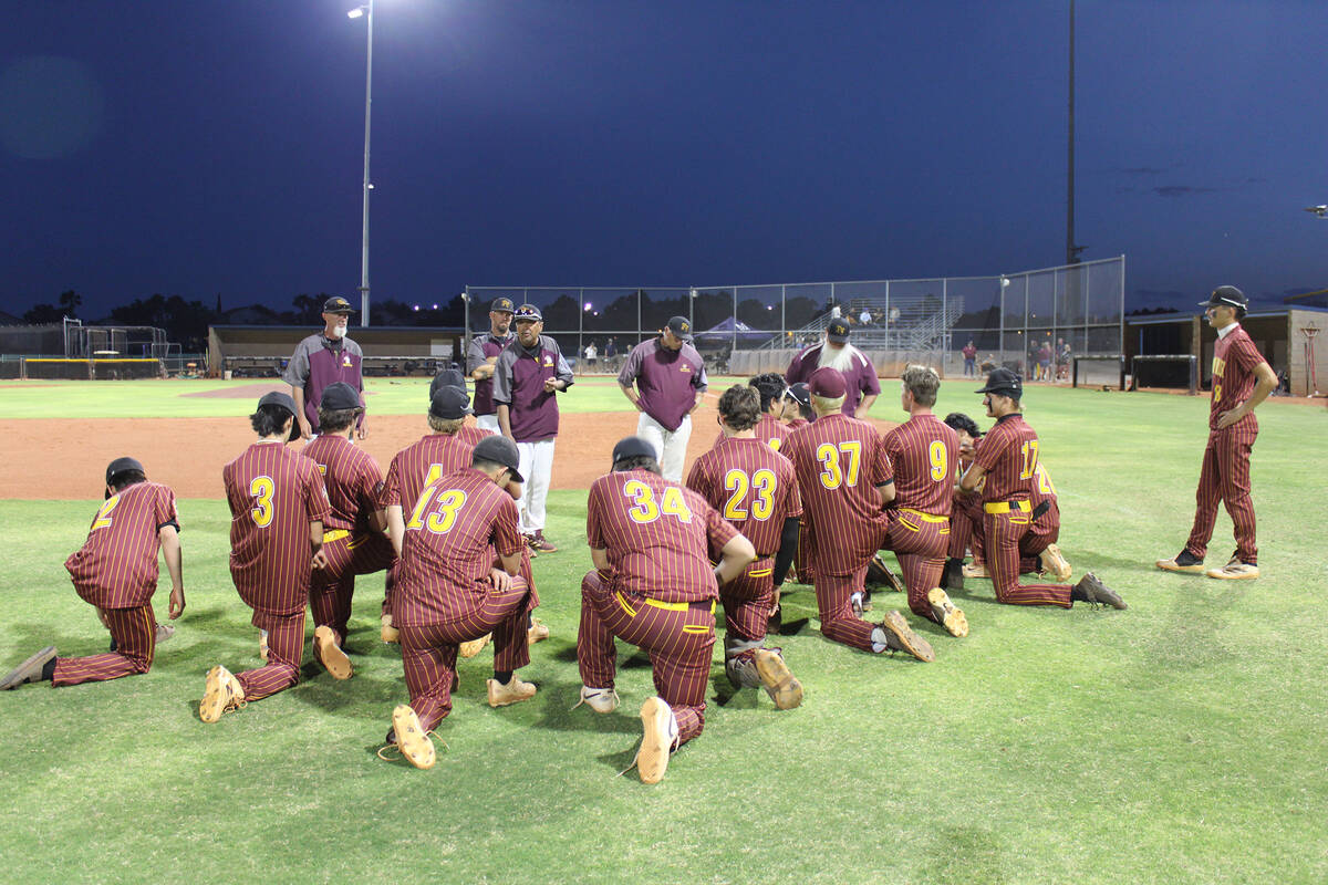 Jacob Powers/Pahrump Valley Times Trojans head coach Roy Uyeno consoles the team after a tough ...