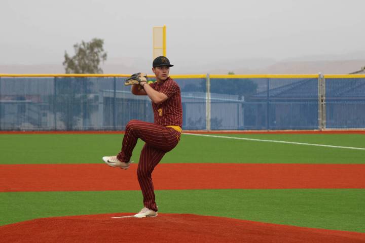 Jacob Powers/Pahrump Valley Times Trojans Sophomore Cody Fried pitches to Moapa Valley.