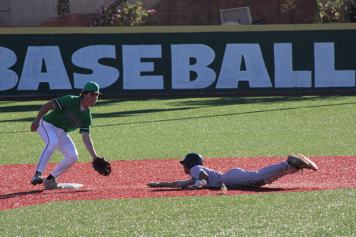 Jacob Powers/Pahrump Valley Times Trojans Vinny Whitney swipes a bag against Virgin Valley.