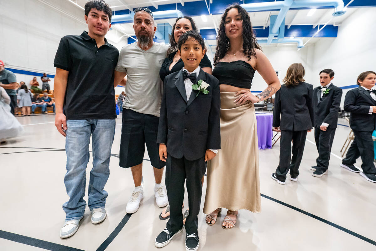 John Clausen/Pahrump Valley Times A cotillion graduate poses with his family after the event.