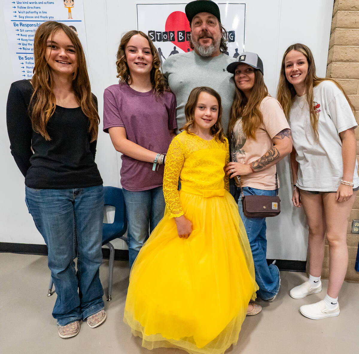 John Clausen/Pahrump Valley Times A cotillion graduate poses with her family after the event.