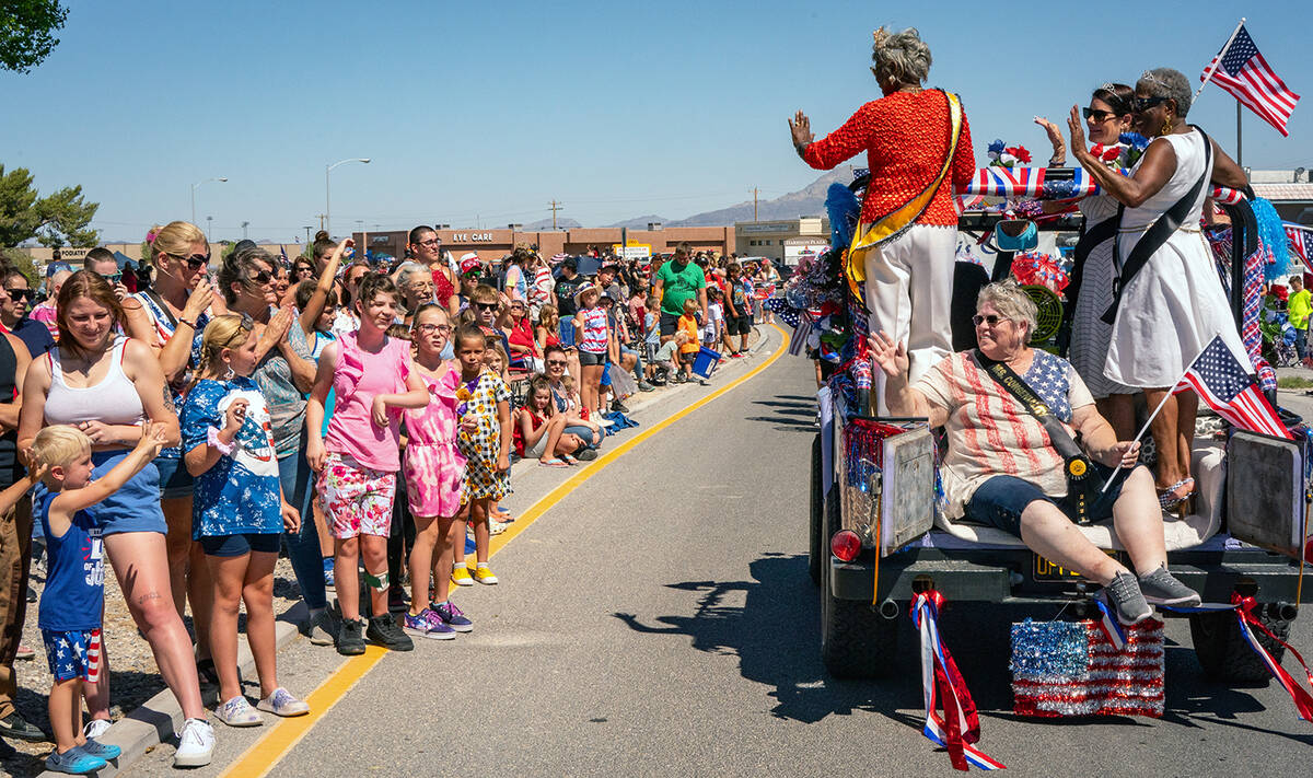 John Clausen/Pahrump Valley Times A multitude of area residents and visitors lined Calvada Blvd ...