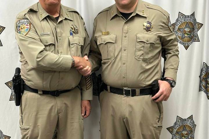 Nye County Sheriff Joe McGill congratulates Cory Fowles on his promotion to undersheriff. (Nye ...