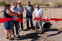 Mandi Campbell (Timbisha Shoshone Tribe) and Bryan Winzenread (Caltrans District 9) cut a cerem ...
