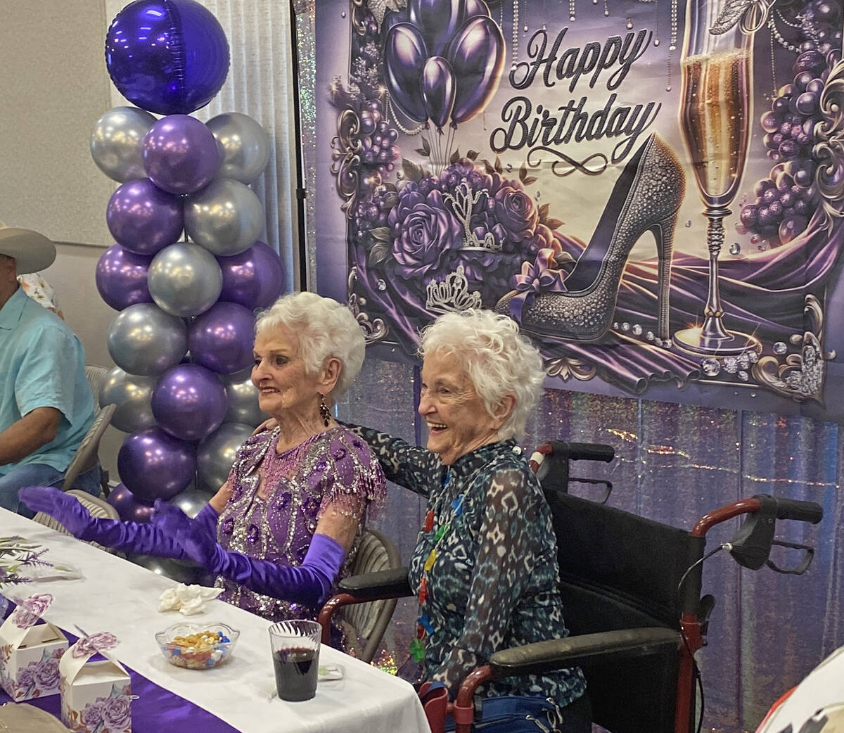 B.J. Hetrick-Irwin, left, sits with her younger sister Jodie to enjoy as the Nevada Silver Tapp ...