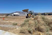 Crew members with Morales Construction and Top Rank Builders started work on clearing and gradi ...