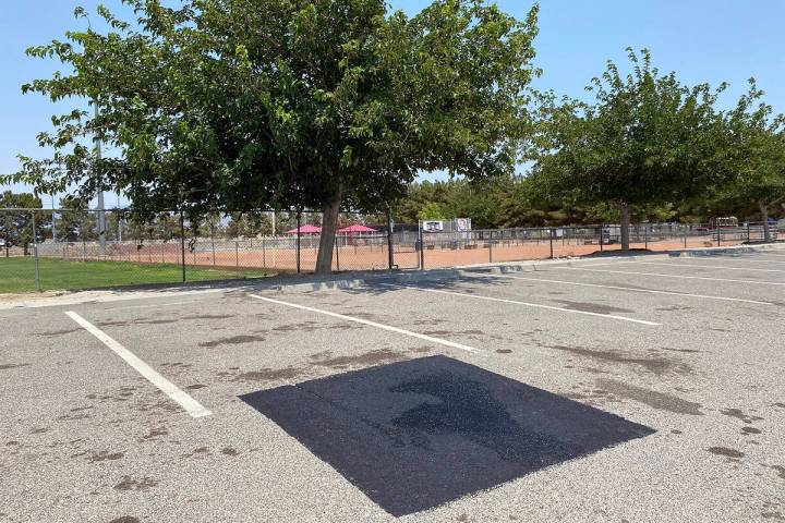 There is now a new patch of asphalt in the parking lot of Ian Deutch Memorial Park, covering up ...