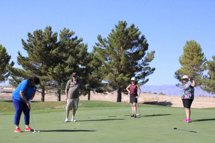 During the 9-Hole scramble tournament at Mountain Falls Golf Course, the PVHS golf team raised ...