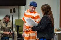 Nevaeh Miller consults with her substitute defense attorney at her initial court appearance at ...