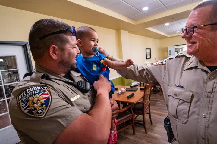Deputy Michael Karr (l) and his son Michael Jr. join Sheriff Joe McGill (r) for a breakfast wit ...