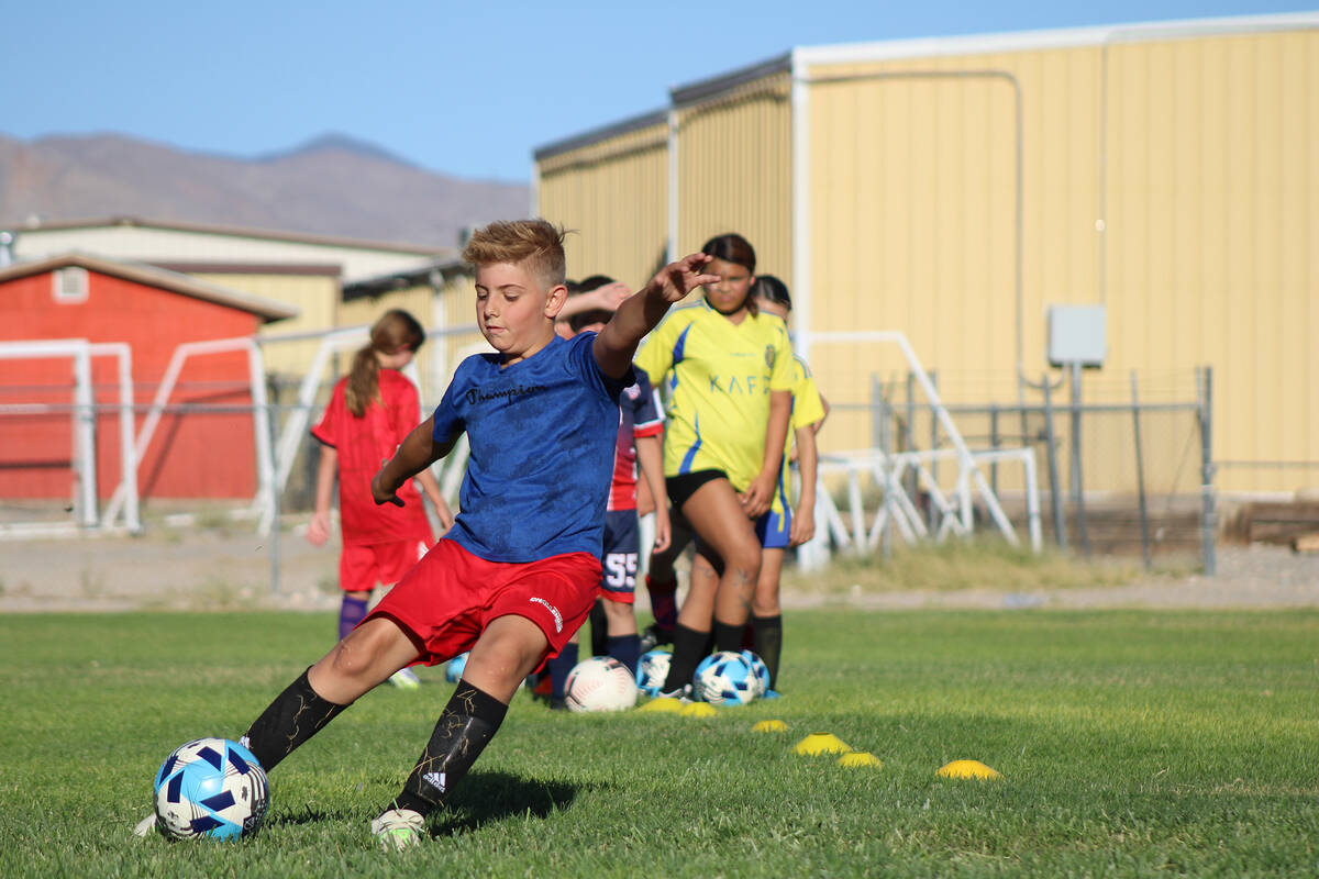 Pahrump youth soccer player Connor McKee sets his footing before drilling a goal during soccer ...