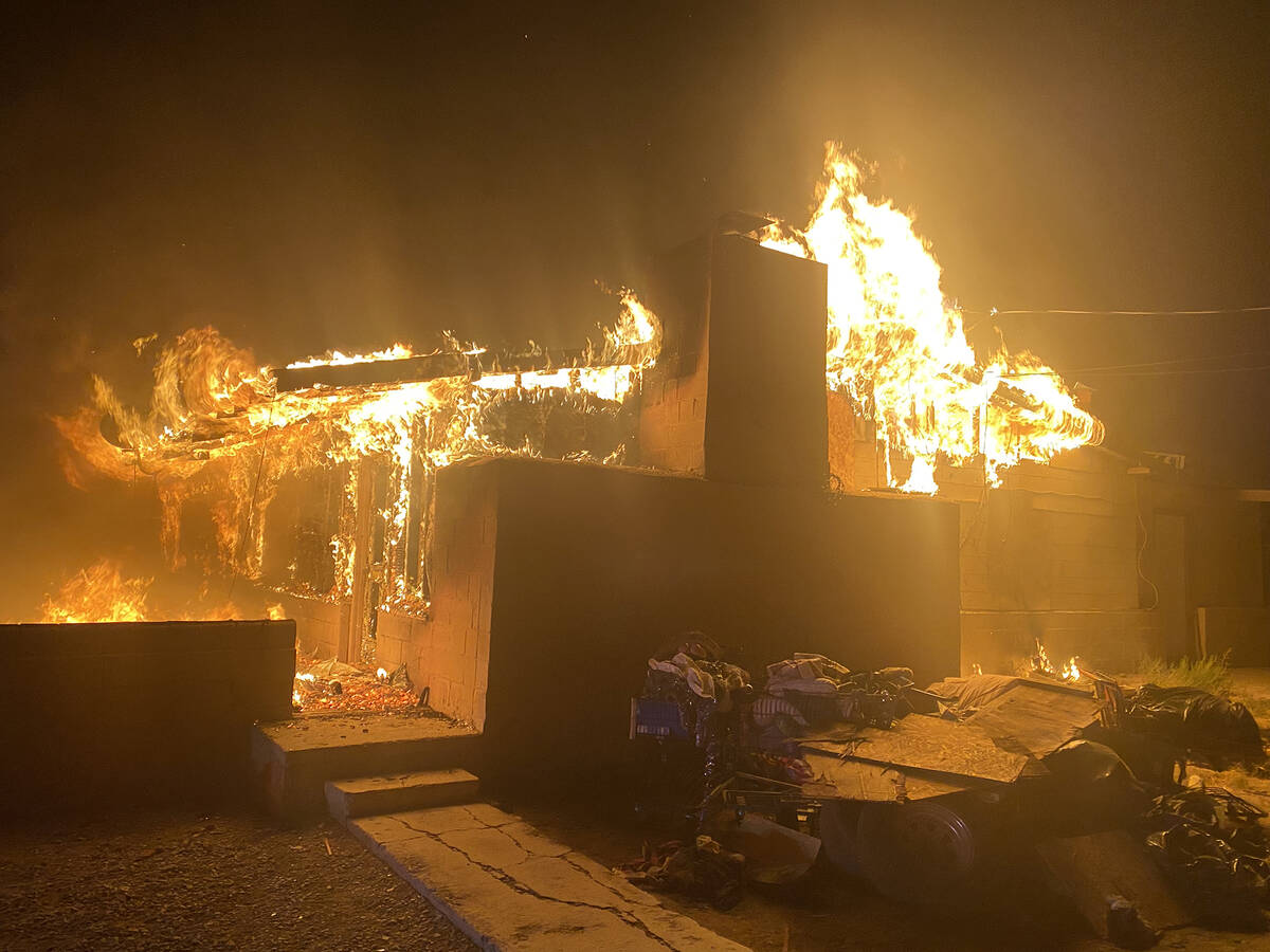 Fire crews arrived to an unoccupied building on West Street with flames burning through the roo ...