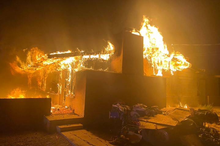 Fire crews arrived to an unoccupied building on West Street with flames burning through the roo ...