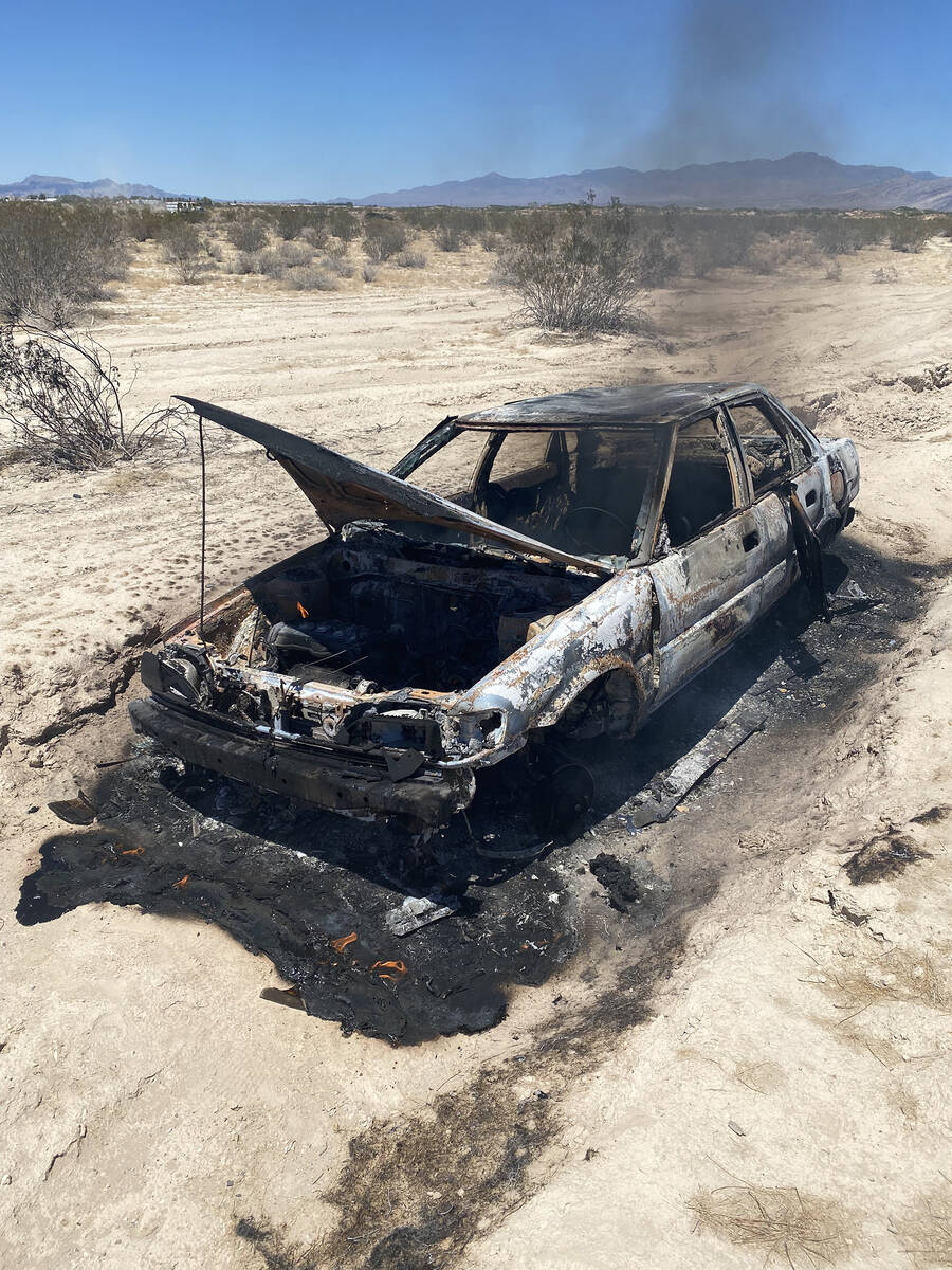 Fire crews arrived to a vehicle fire in the desert, on Thursday afternoon, July 24. (Pahrump Va ...