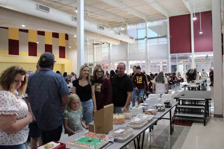 Pahrump Valley High School Spaghetti Dinner attendants check out donated dessert items to bid o ...