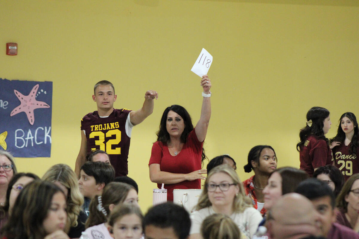 PVHS varsity football player Joshua Slusher and Stephanie Avena from Avena and Sons Electric do ...