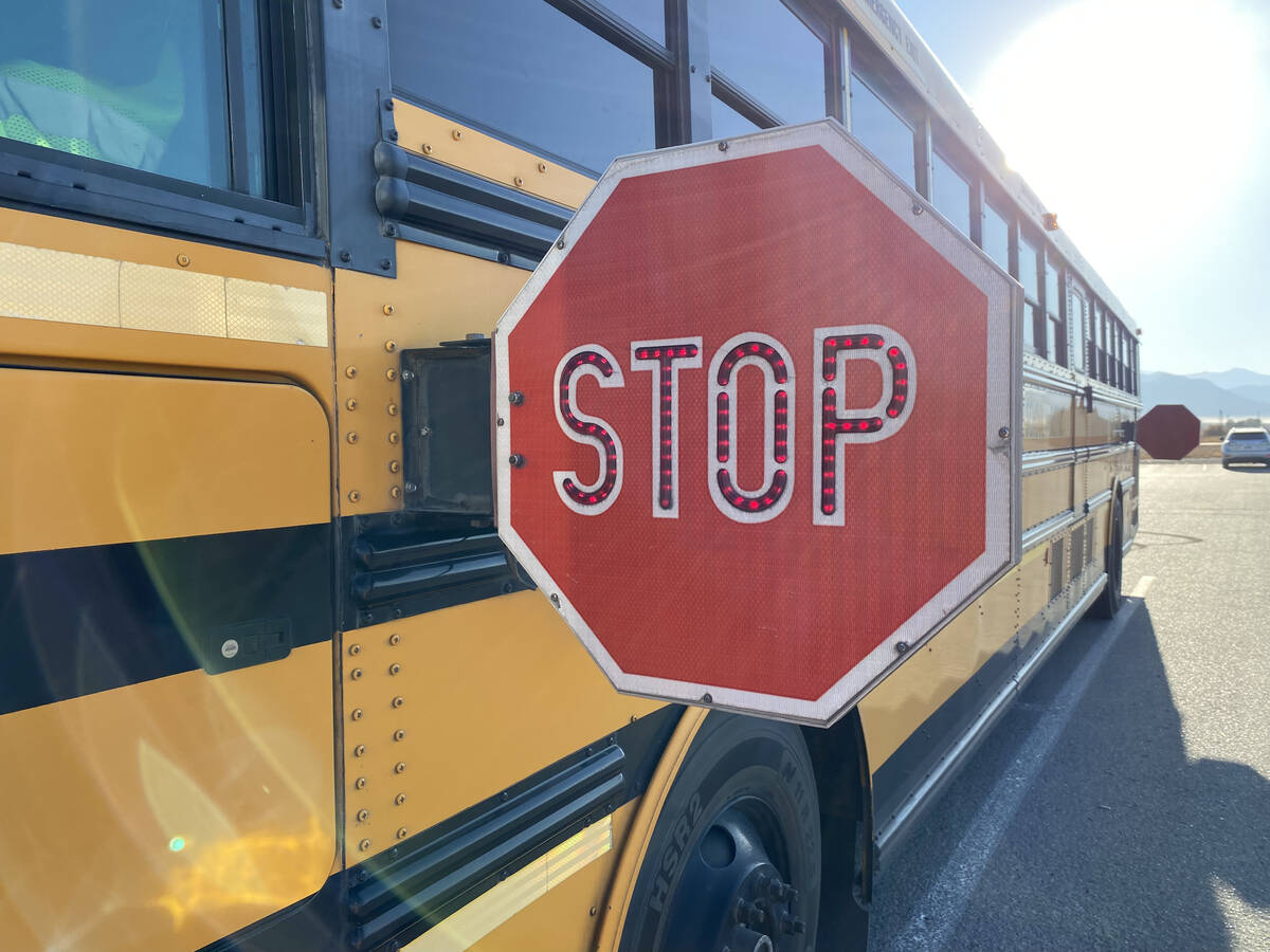 “When a bus is stopped, with its stop signs out and lights flashing, you are required to stop ...