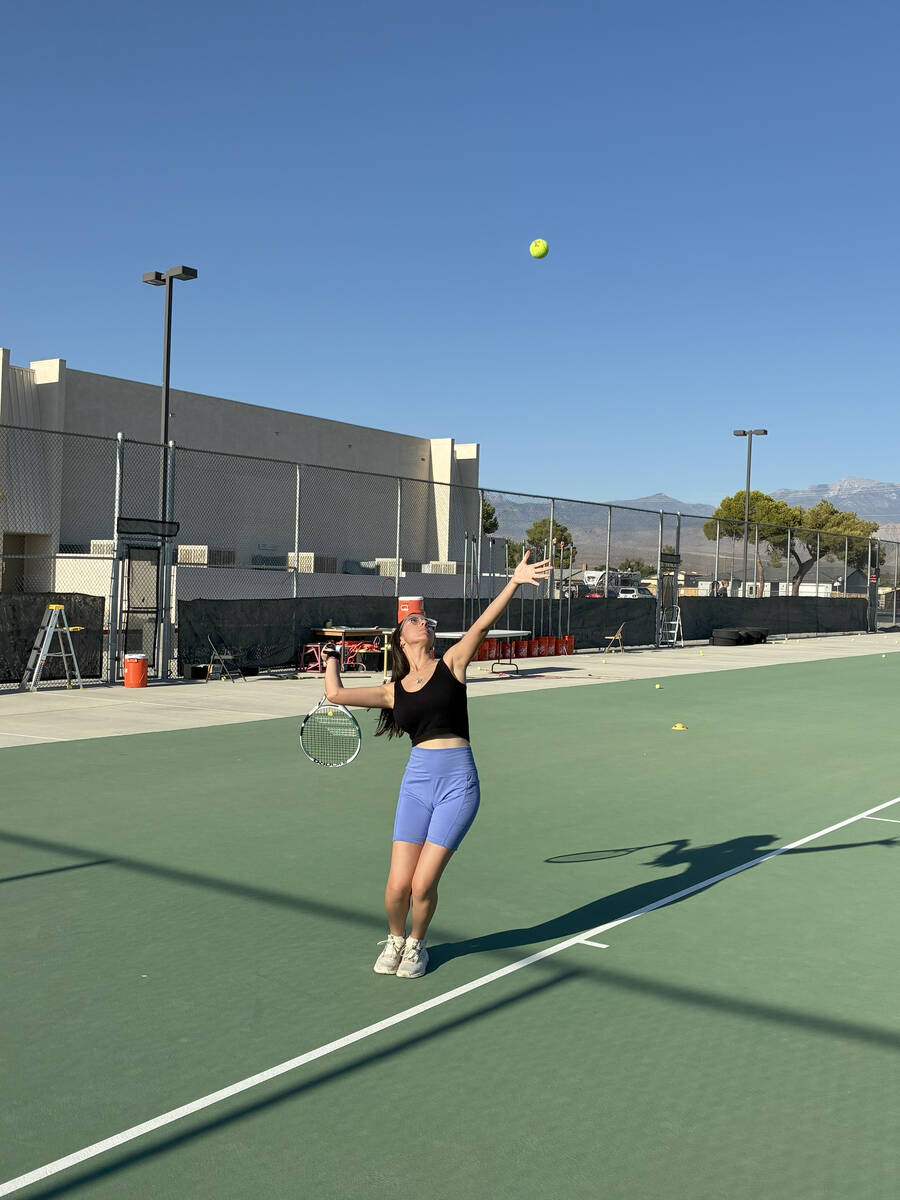 Pahrump Valley High School Tennis junior Milly Khandpur practices her serve at the PVHS Tennis ...