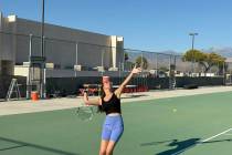 Pahrump Valley High School Tennis junior Milly Khandpur practices her serve at the PVHS Tennis ...