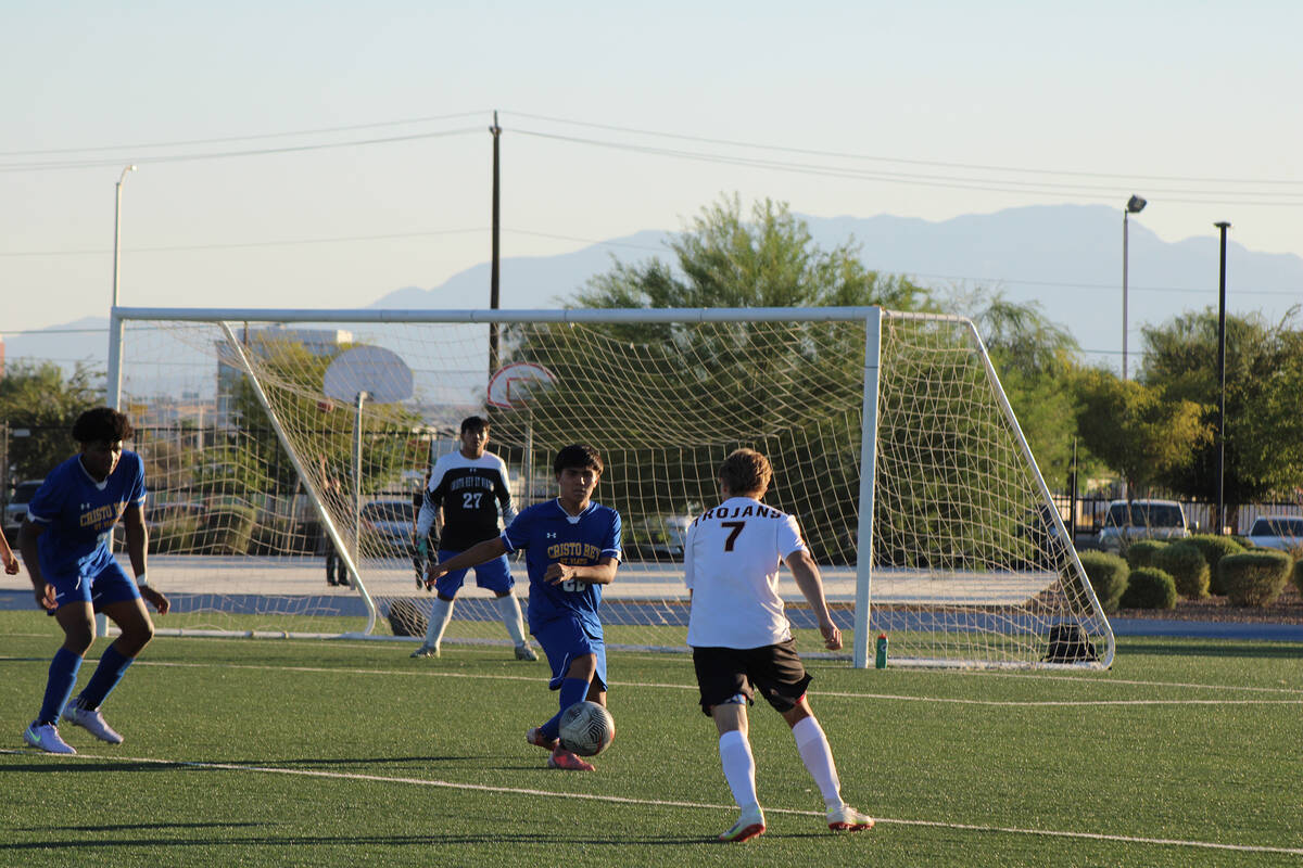 Pahrump Valley High School varsity junior midfielder TC Hone advances the ball against Cristo R ...