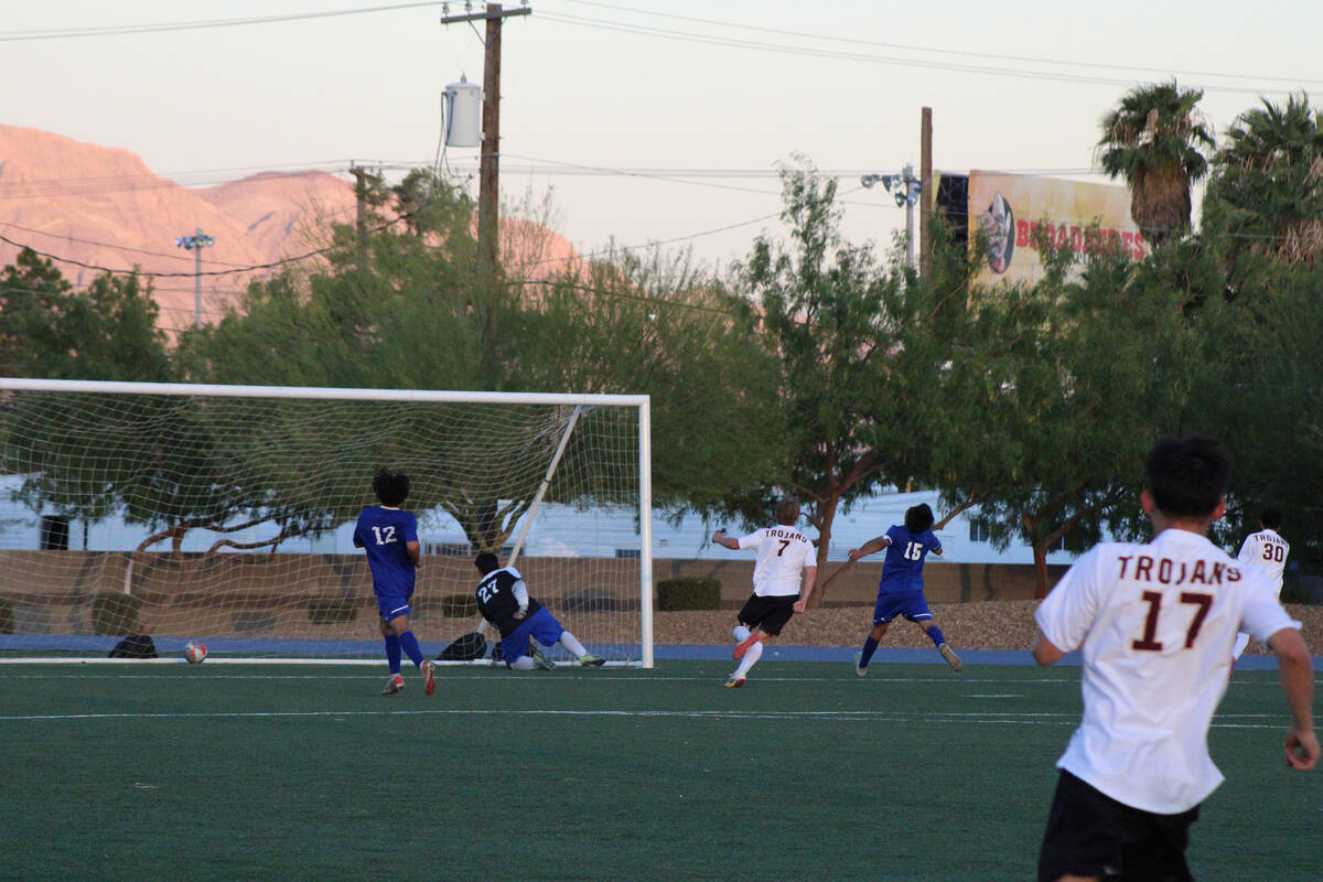 Pahrump Valley High School midfielder Roberto Gonzalez finishes his shot to tie the game at one ...