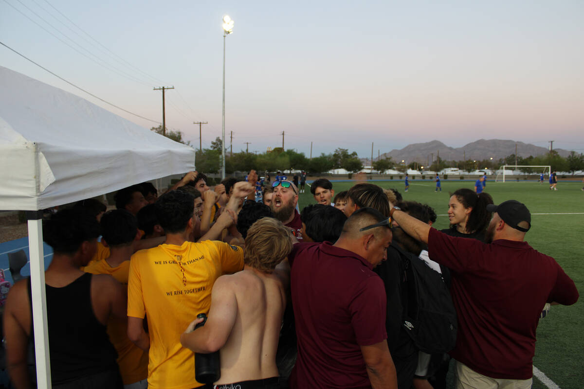 Head coach Andrew Norton leads the rally charge after a come-from-behind win against Cristo Rey ...