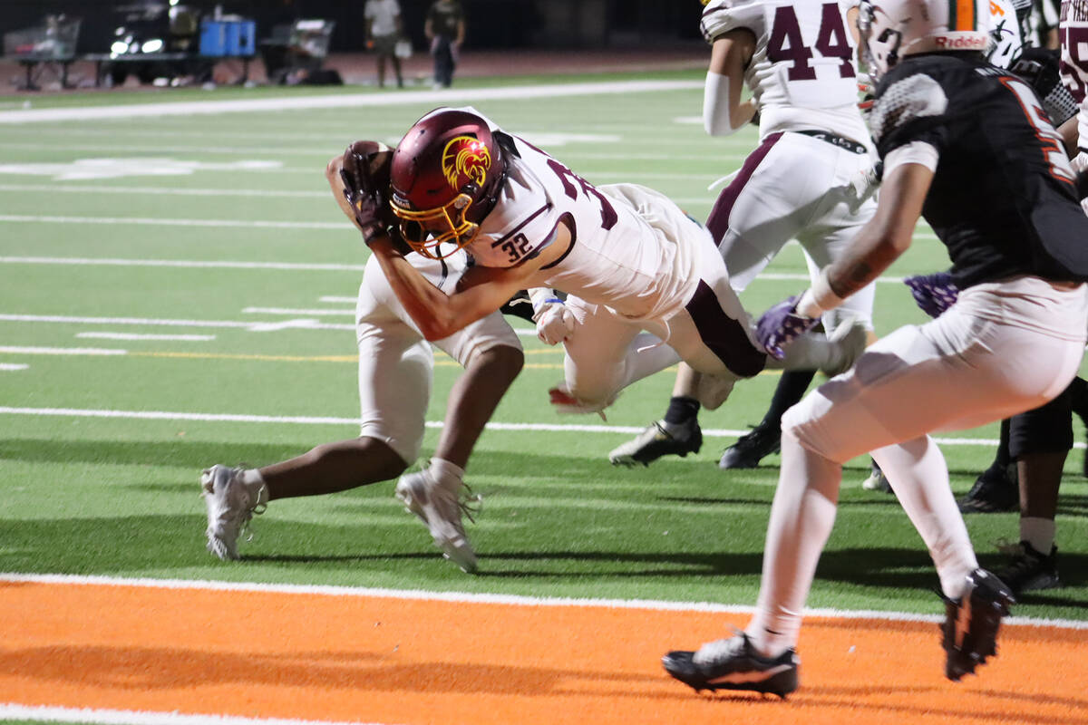 Pahrump Valley High School running back Joshua Slusher finds his way into the end zone against ...