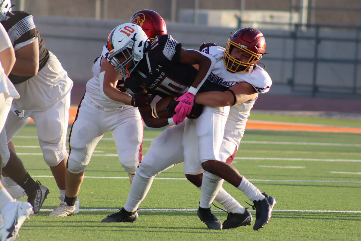 Pahrump Valley High School football defender Preston Dockter makes the tackle against Mojave Hi ...