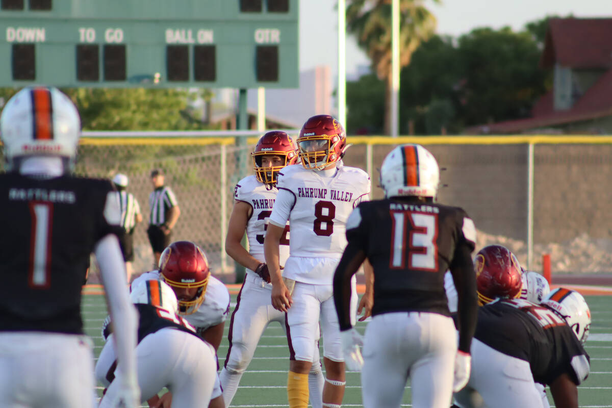 Pahrump Valley High School varsity quarterback Kayne Horibe begins to call for a snap in a scri ...
