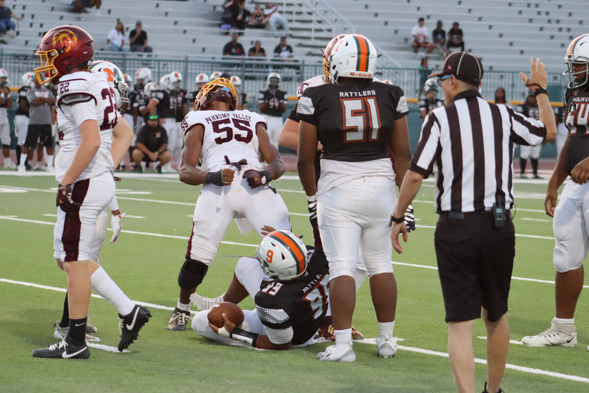 Pahrump Valley High School linebacker Iyan Bosket celebrates after making a tackle against Moja ...
