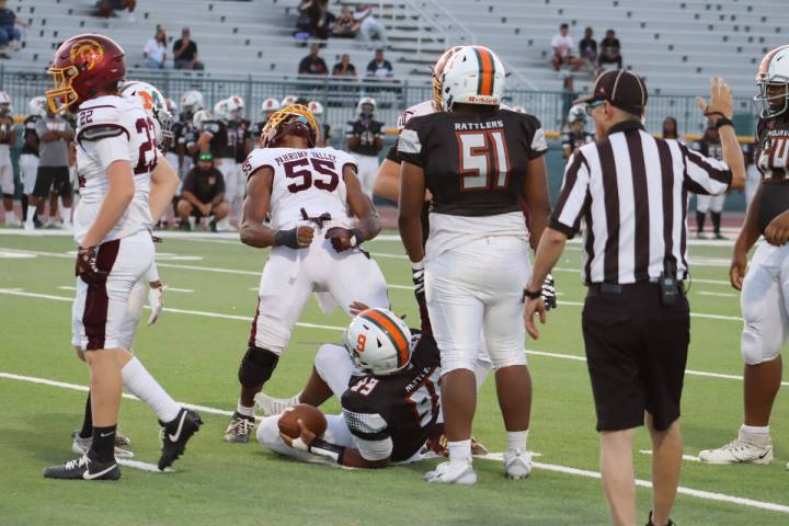 Pahrump Valley High School linebacker Iyan Bosket celebrates after making a tackle against Moja ...