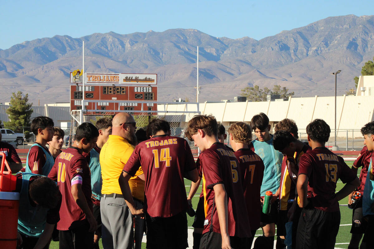 Pahrump Valley High School boys soccer head coach Andrew Norton gives the team words of encoura ...