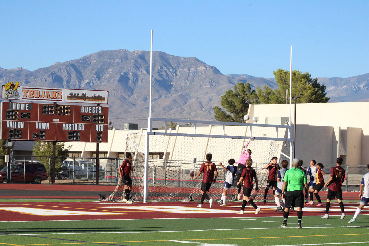 Pahrump Valley High School boys soccer senior goalkeeper Cayden "The Pink Panther" Cowley makes ...