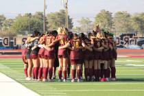 The Pahrump Valley High School girls soccer team huddles together for a team meeting before tak ...
