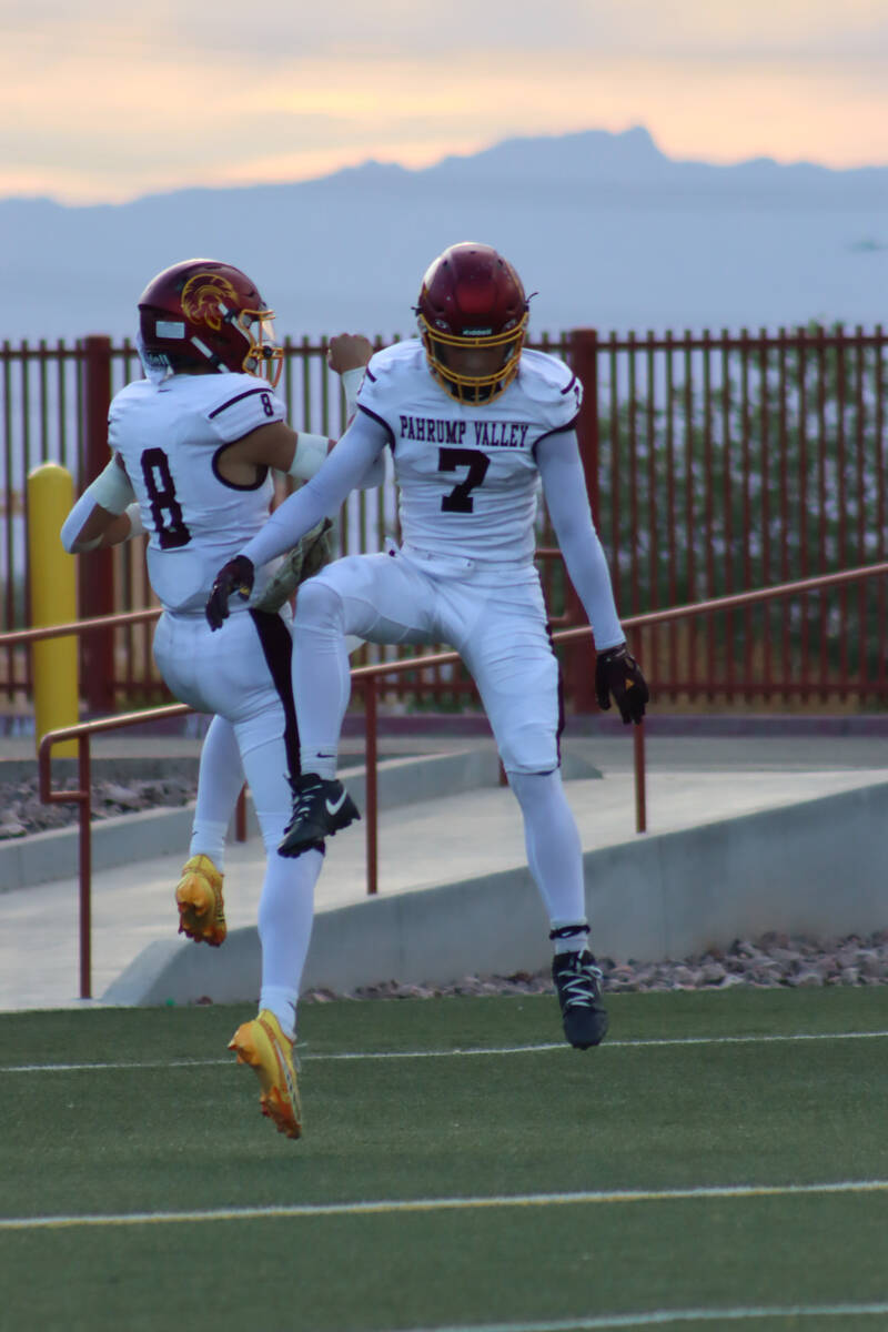 Senior QB Kayne Horibe and junior Ryan Hamlin celebrate following a touchdown against Pinecrest ...