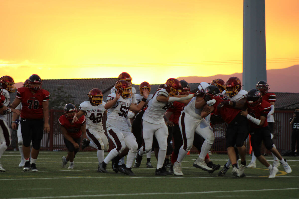 The Trojans secondary defense holds Pinecrest Academy Cadence behind the line late in the secon ...