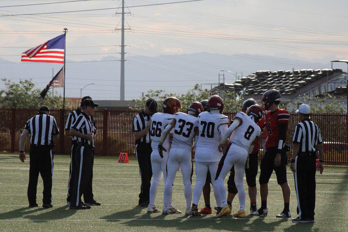 Trojans team c0-captains Jack Walker, Austin Alvarez, Billy Sparks and Kayne Horibe shake hands ...
