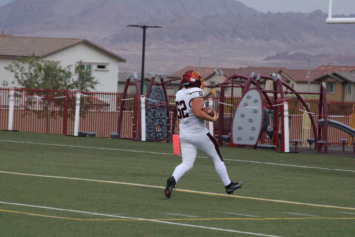 Trojans junior guard Preston Doctor scooped up a blocked punt that resulted in a touchdown agai ...