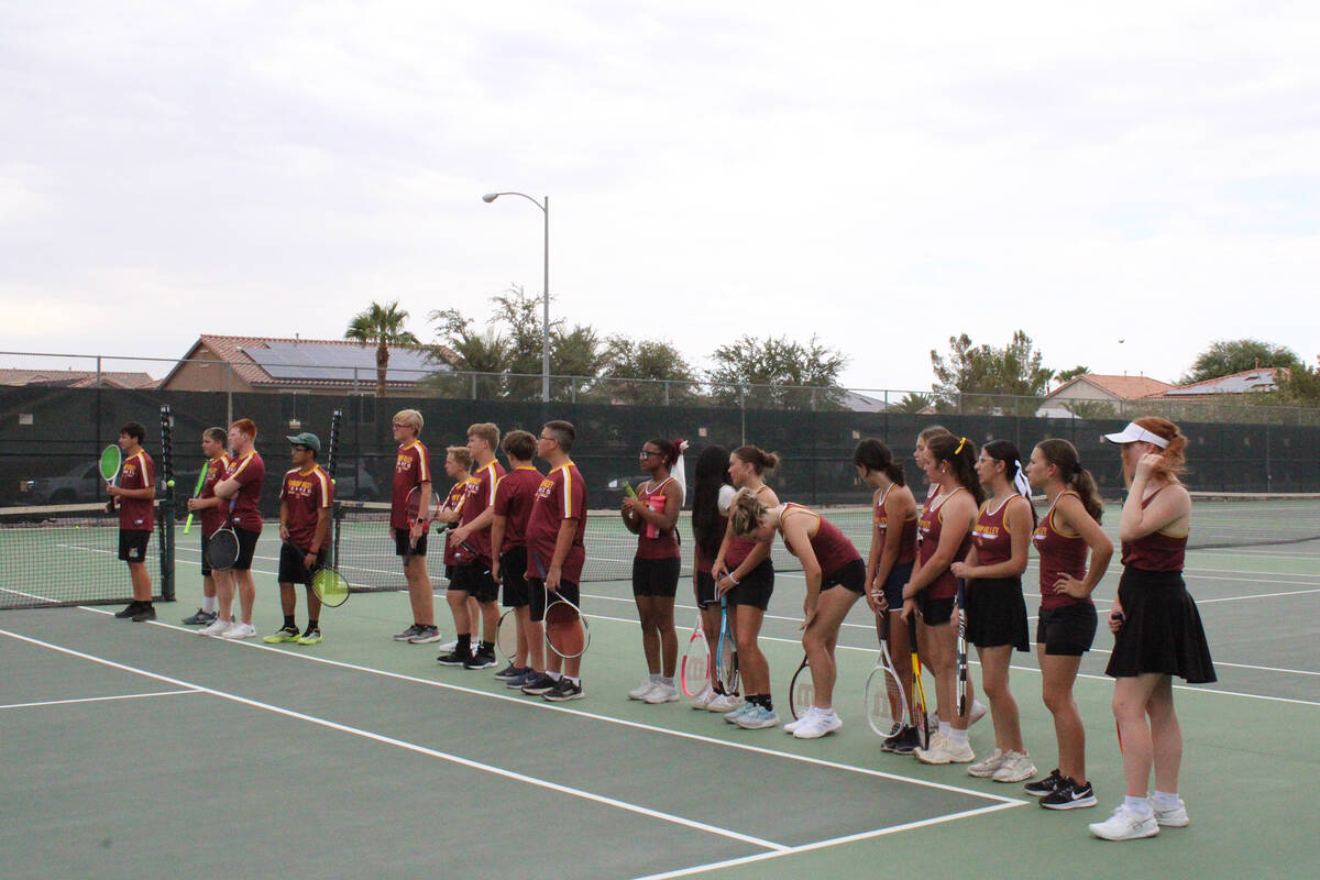 The 2025 Pahrump Valley High School tennis team lines up for match-up introductions during thei ...