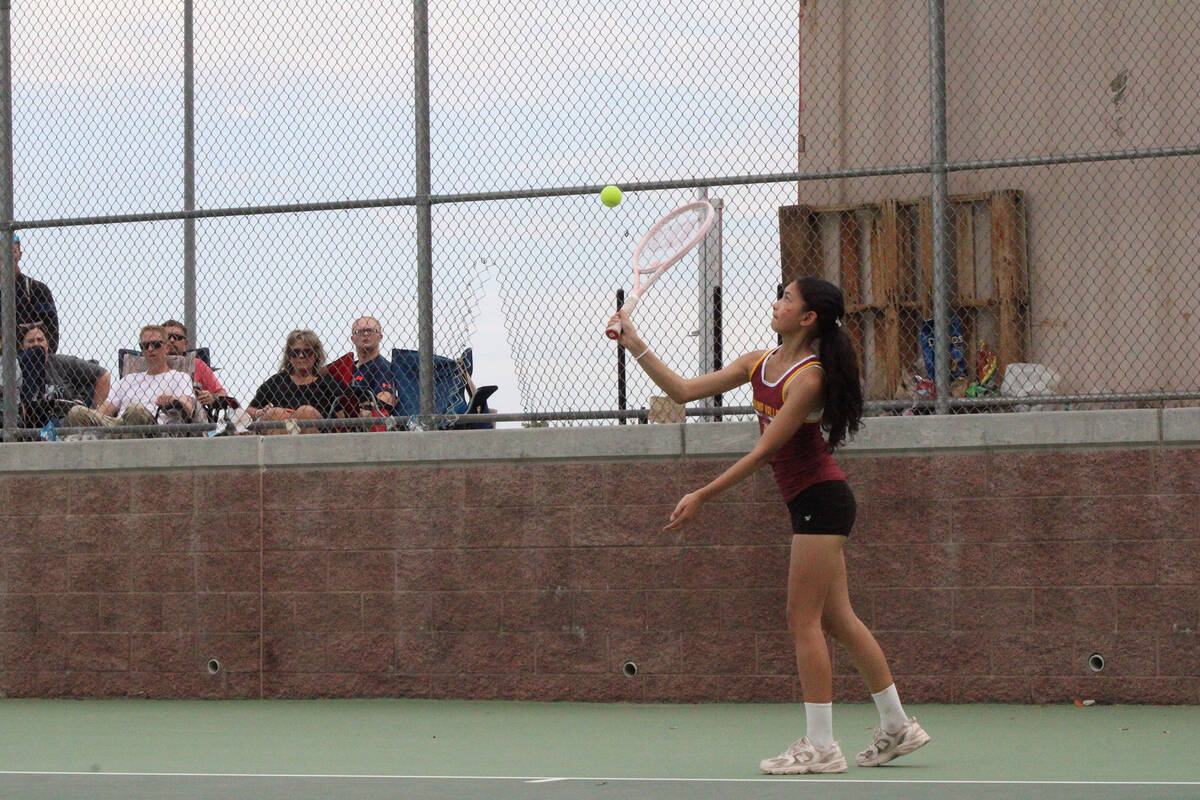Pahrump Valley High School tennis sophomore Allison Amador prepares a serve to her opponent dur ...