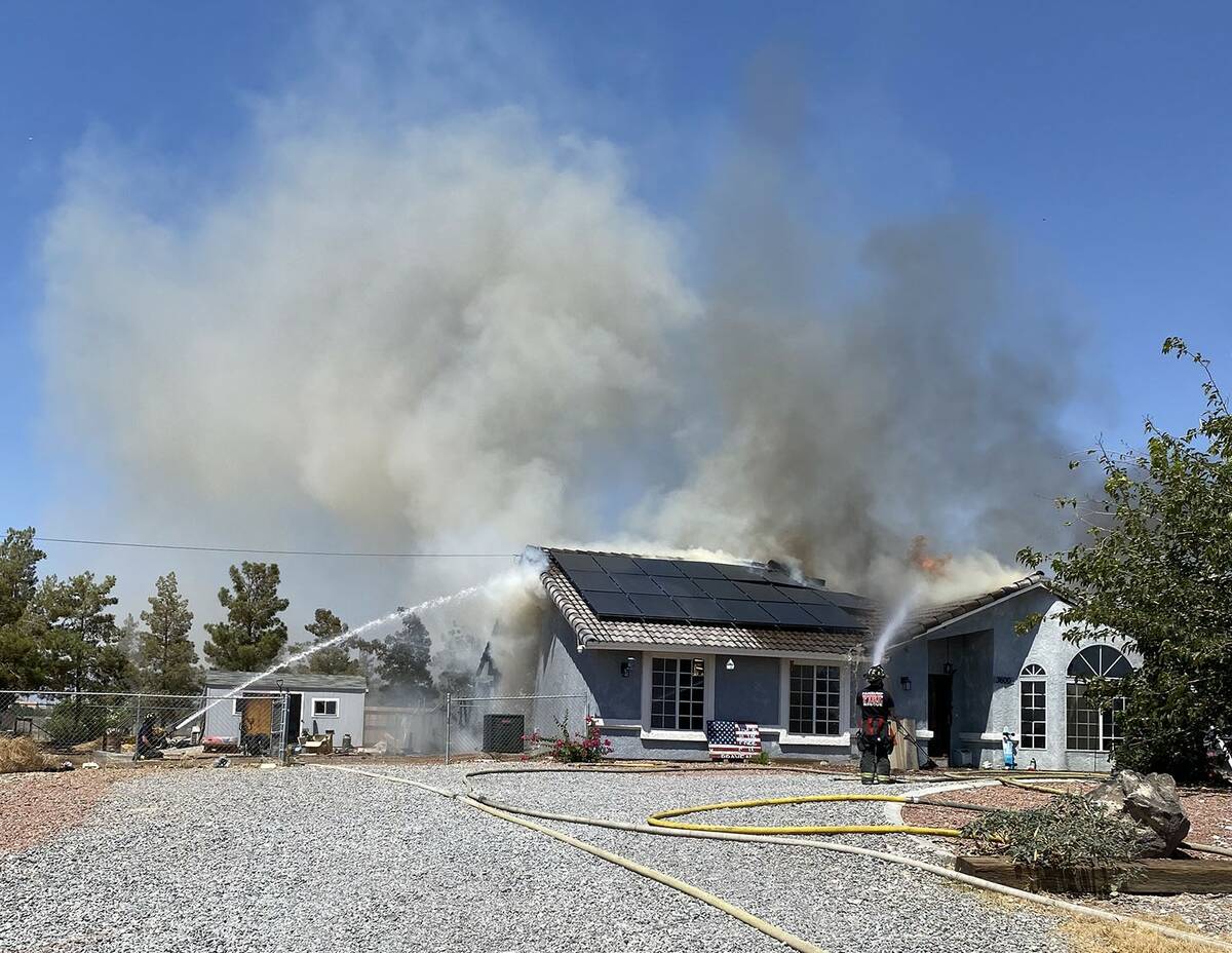 Crews originally tried to extinguish the flames from the inside, but the roof became compromise ...