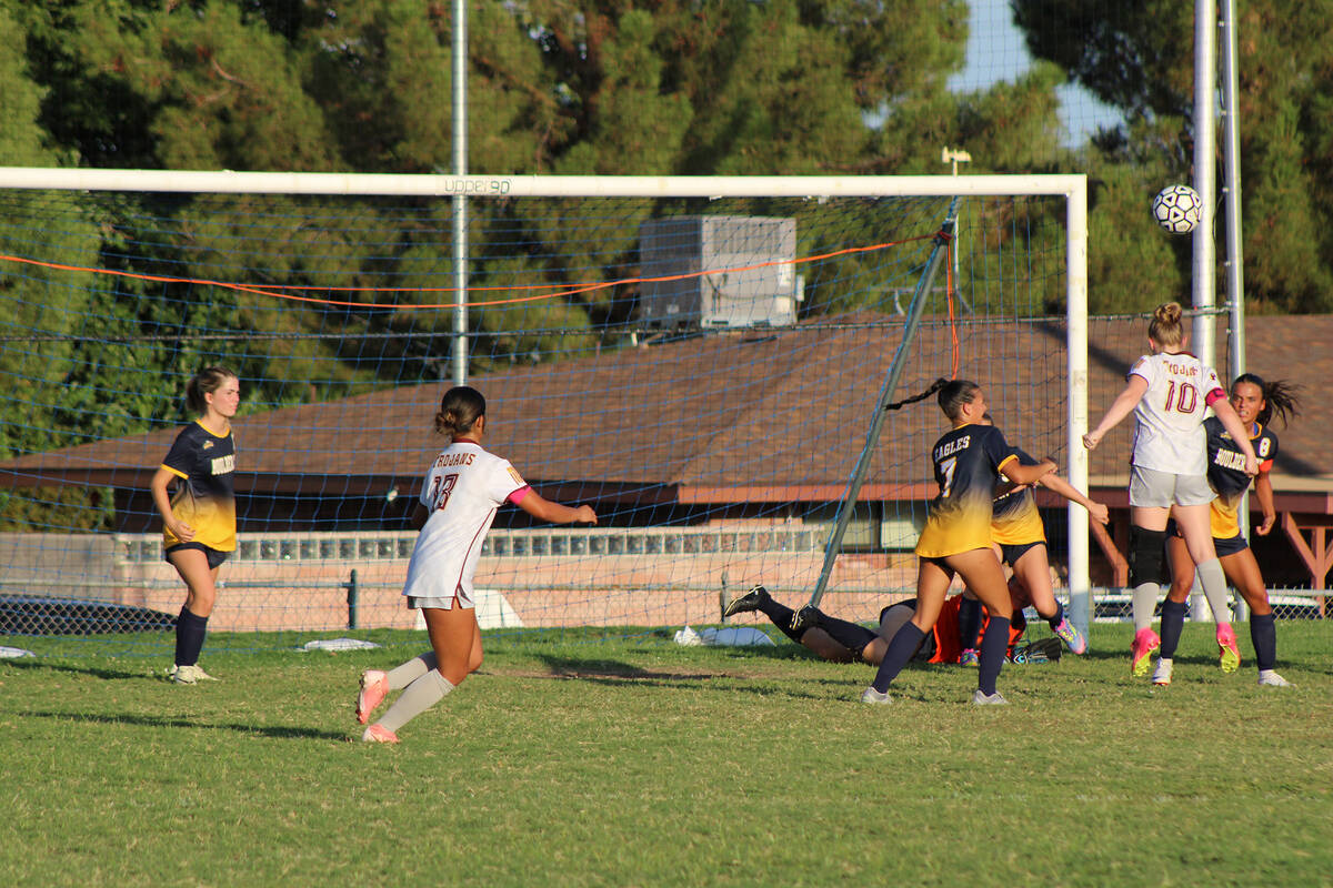 Pahrump Valley High School girls soccer co-captain Aubrey Williams gets a header on the ball in ...