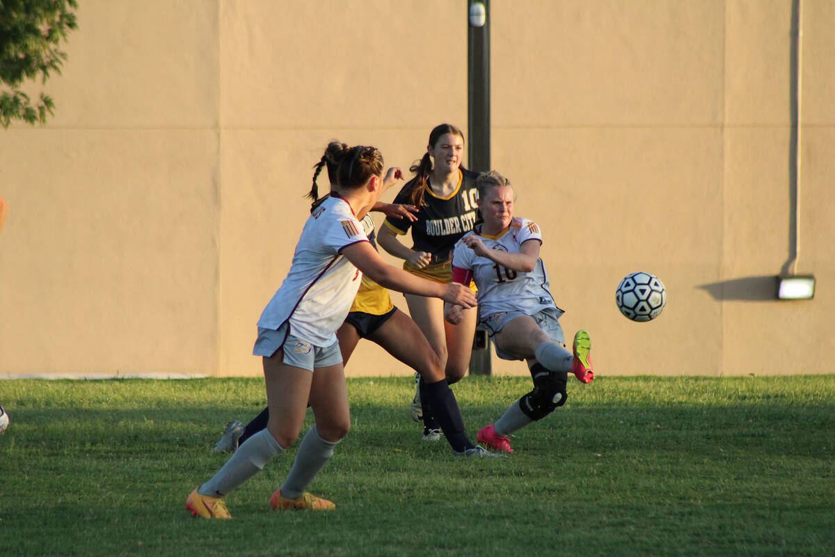 Pahrump Valley High School girls soccer co-captain Aubrey Williams kicks the ball away from the ...