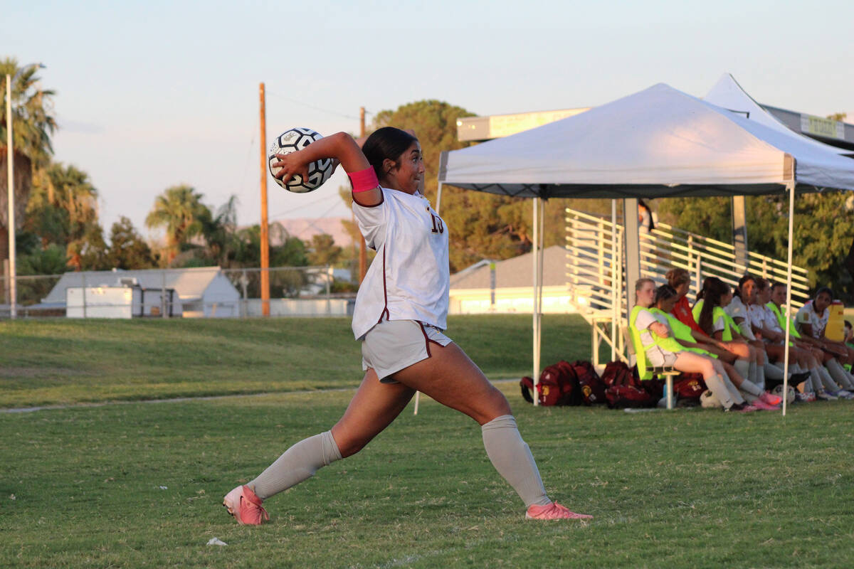 Pahrump Valley High School girls soccer co-captain Natalie Soto throws the ball back in bounds ...