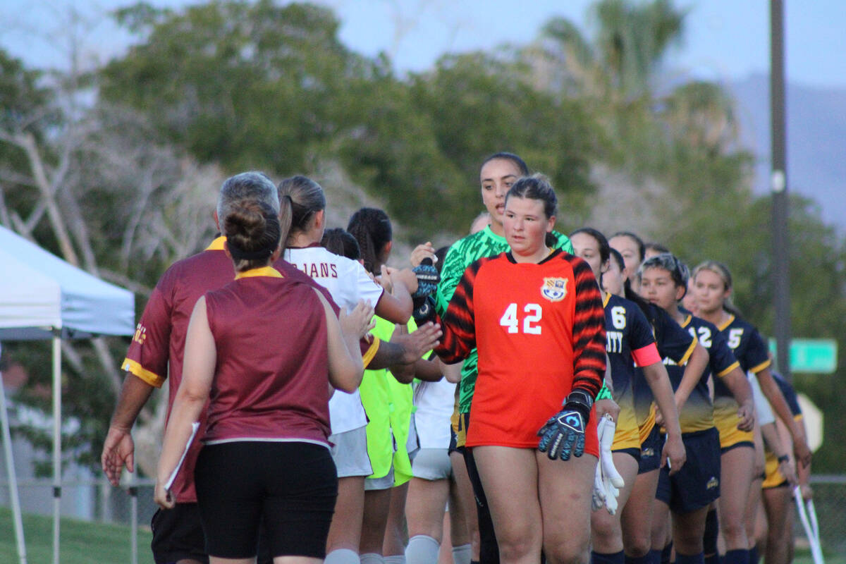 The Trojans shake hands with the Eagles following their league away loss to Boulder City High S ...