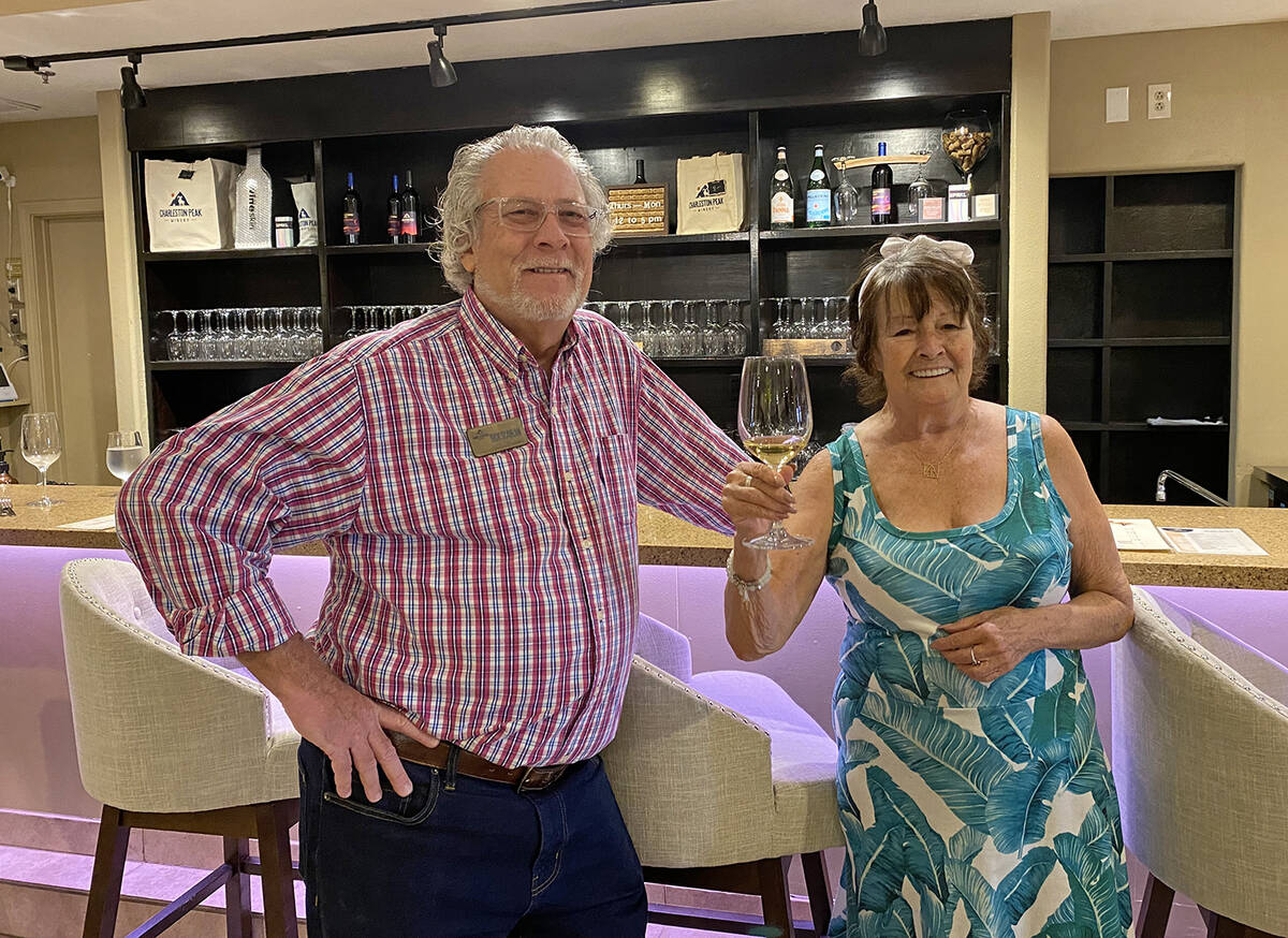 Charleston Peak Winery patron Kathleen O'Connor, right, stands with sommelier Rick Scanlan insi ...